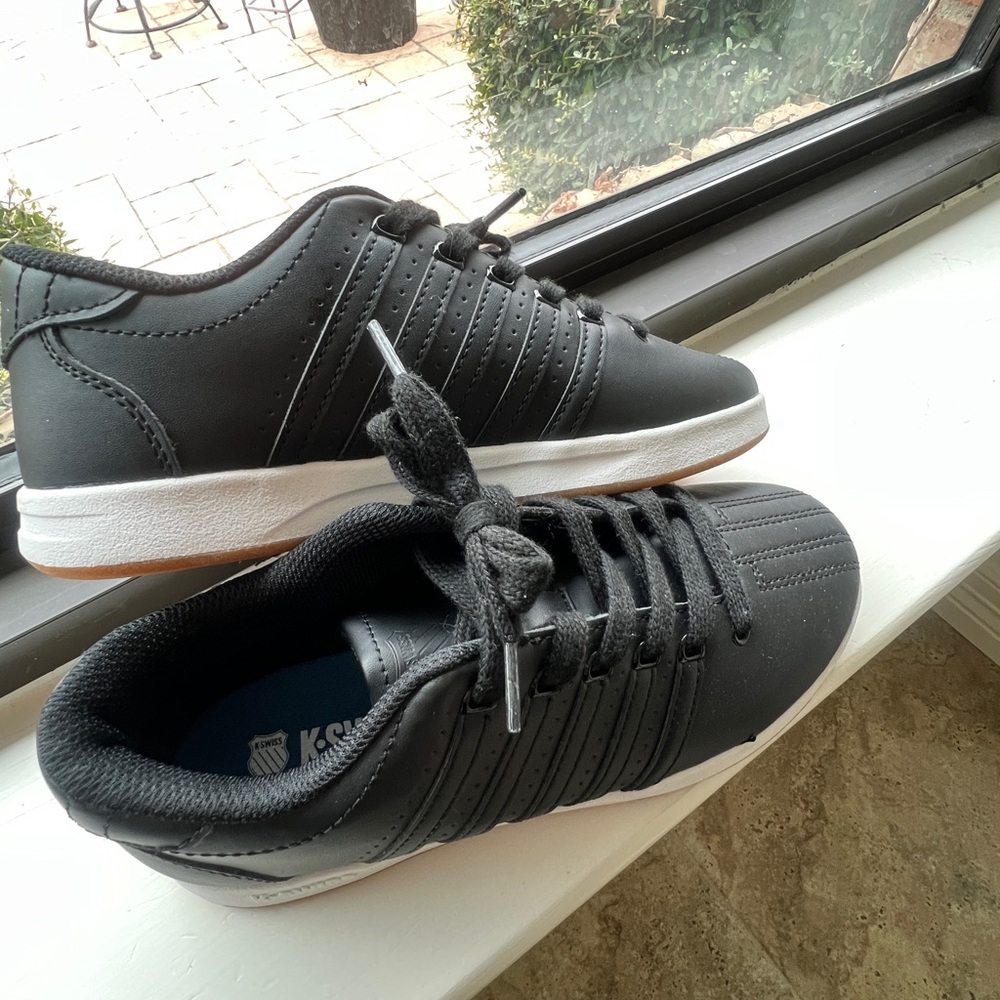 Brand new K-Swiss leather tennis shoes for either teen or small shoe adult.